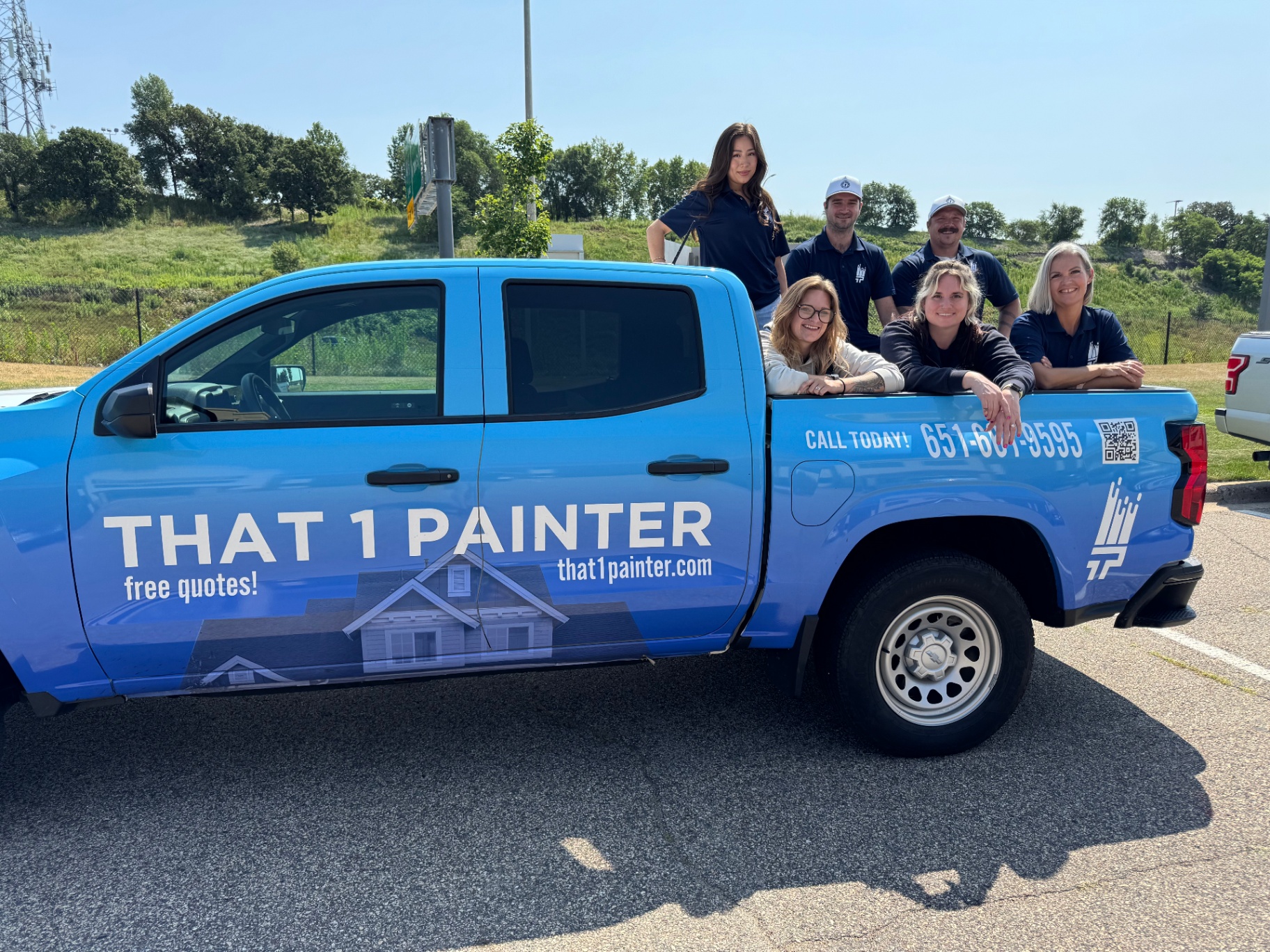 The locally owned That 1 Painter Twin Cities team with their branded truck in Edina, MN