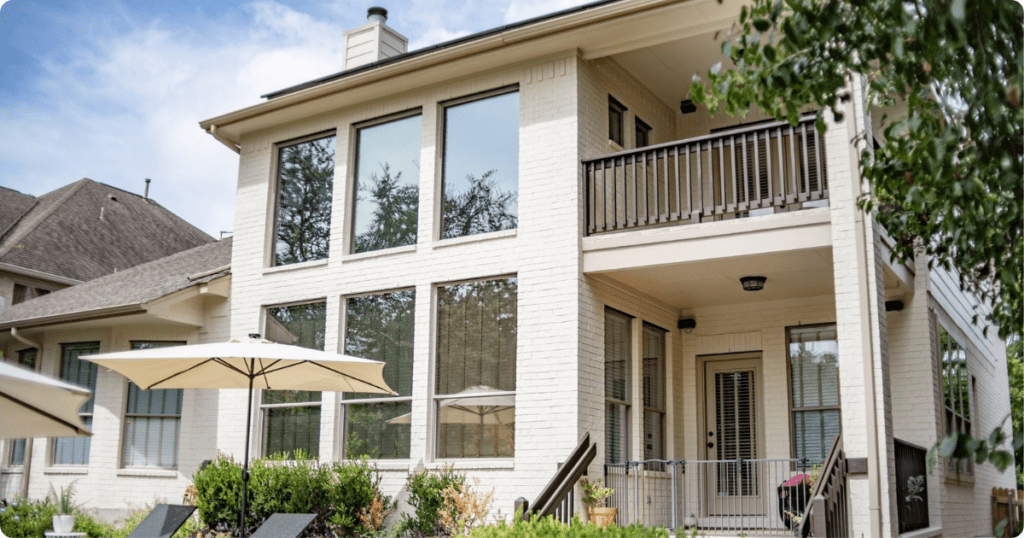exterior-painting-in-albiene-san angelo-big-house-with-windows-and-balcony-from-that-1-painter.png