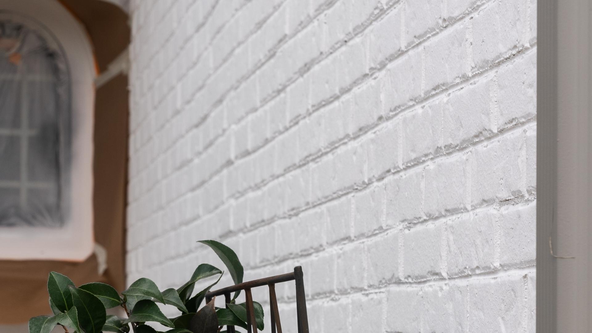 Brick located on the exterior of a home that has been lime washed