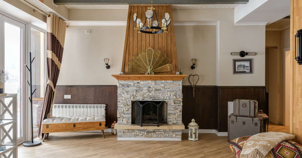 Living room with a stone fireplace and two-tone painted walls in St. Paul, MN