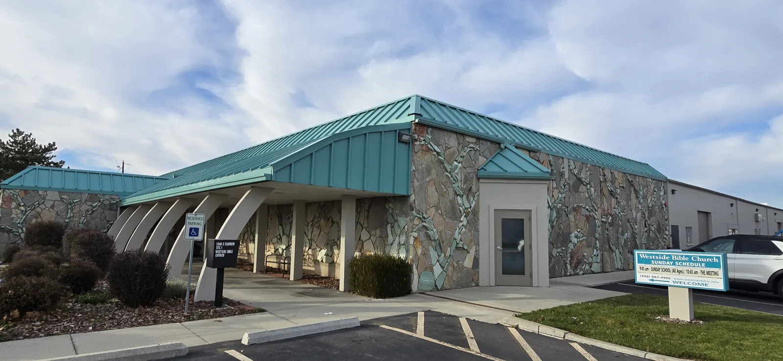 Meridian commercial building exterior with stone facade and standing-seam roof repainted by That 1 Painter Treasure Valley