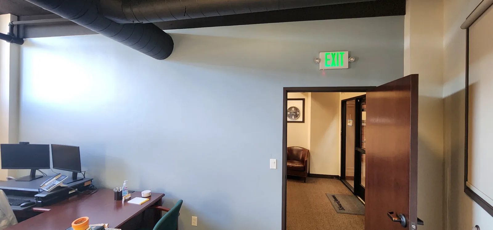 Nampa professional office interior repainted in soft grey with exposed ductwork by That 1 Painter Treasure Valley