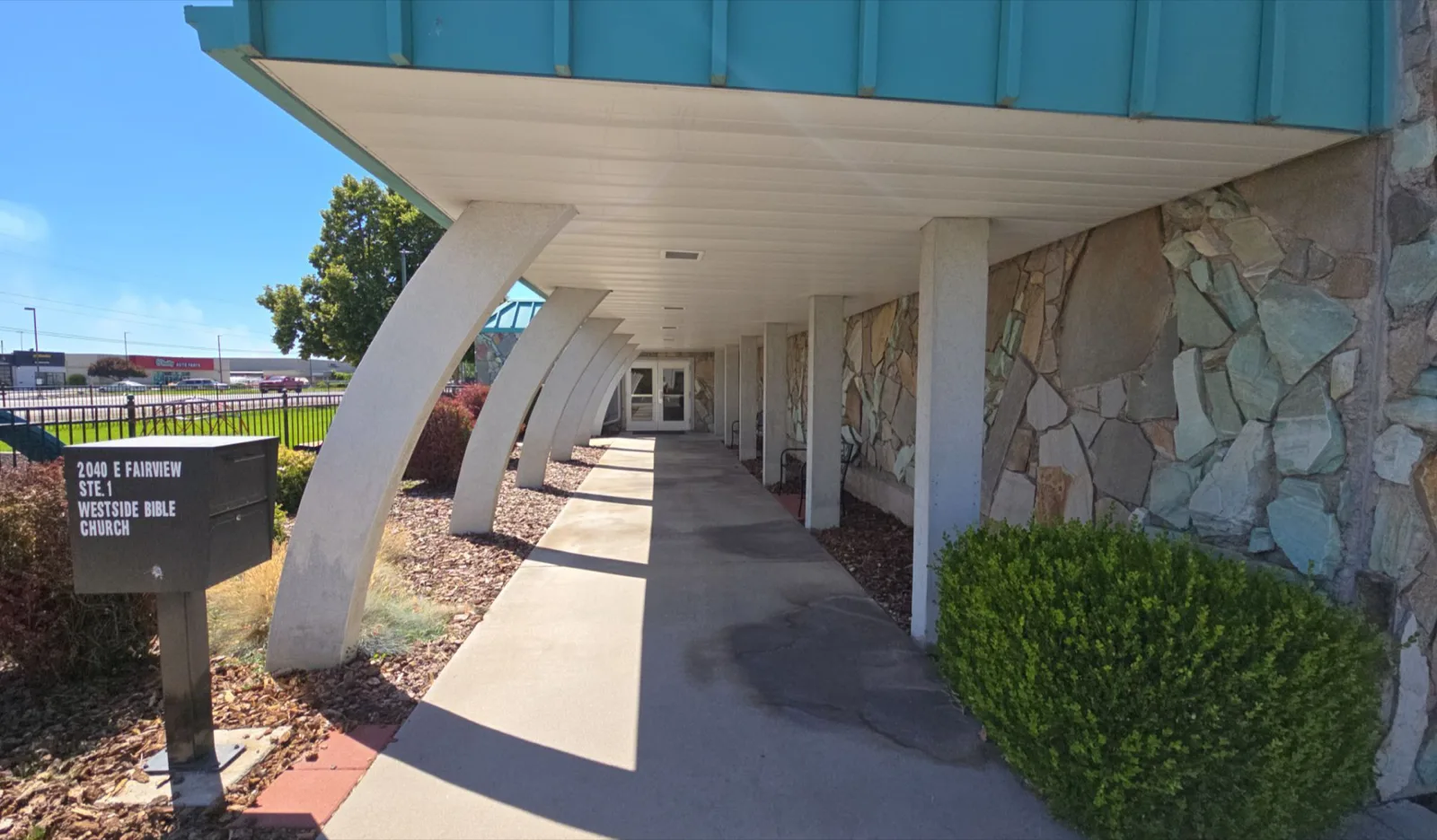 Commercial building facade and parking elevation before repainting by That 1 Painter Treasure Valley