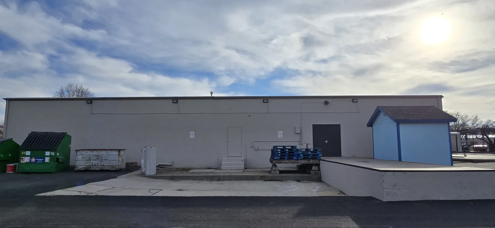 Same warehouse loading elevation repainted in clean white by That 1 Painter Treasure Valley