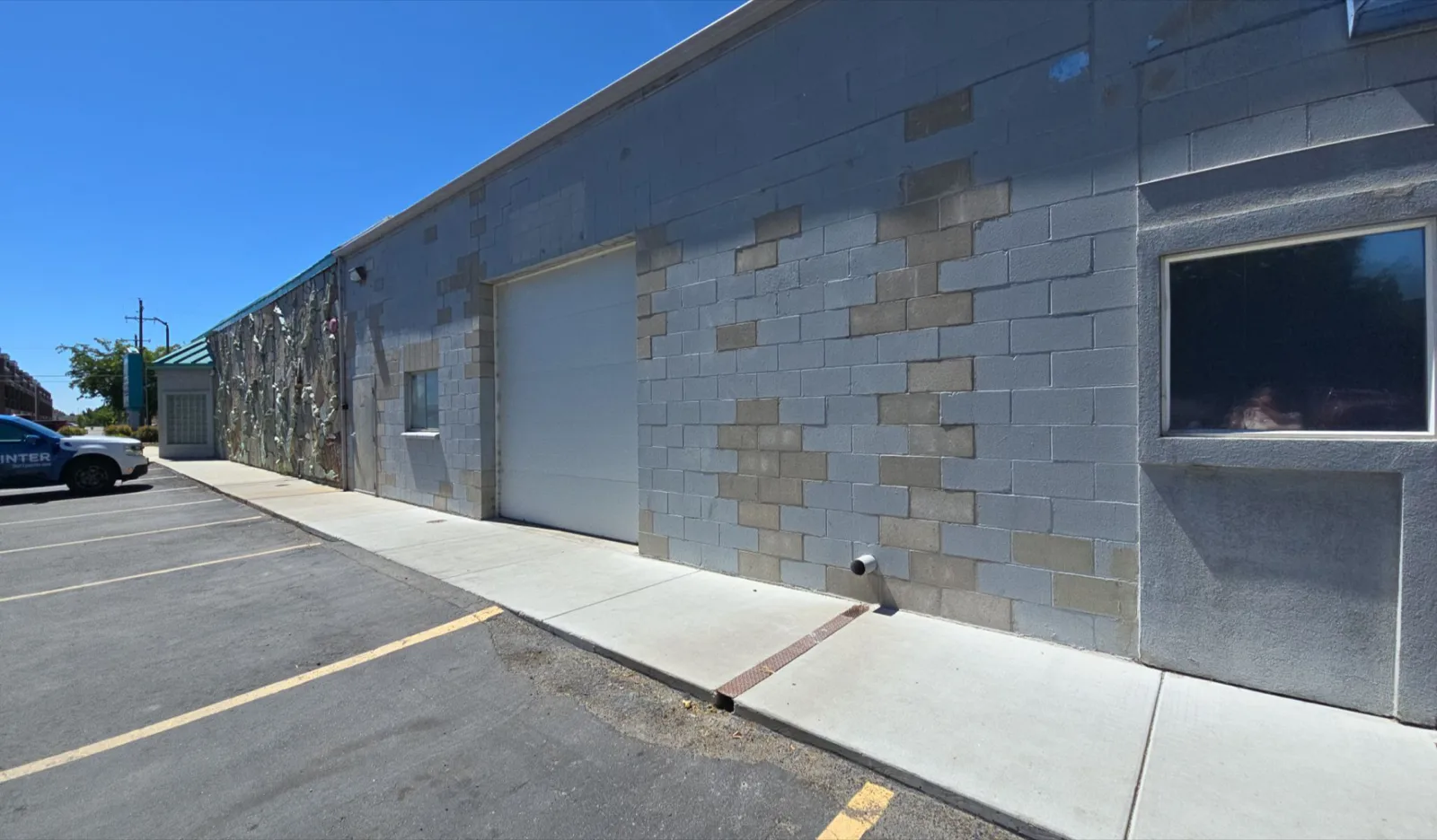Commercial block wall elevation before repainting by That 1 Painter Treasure Valley