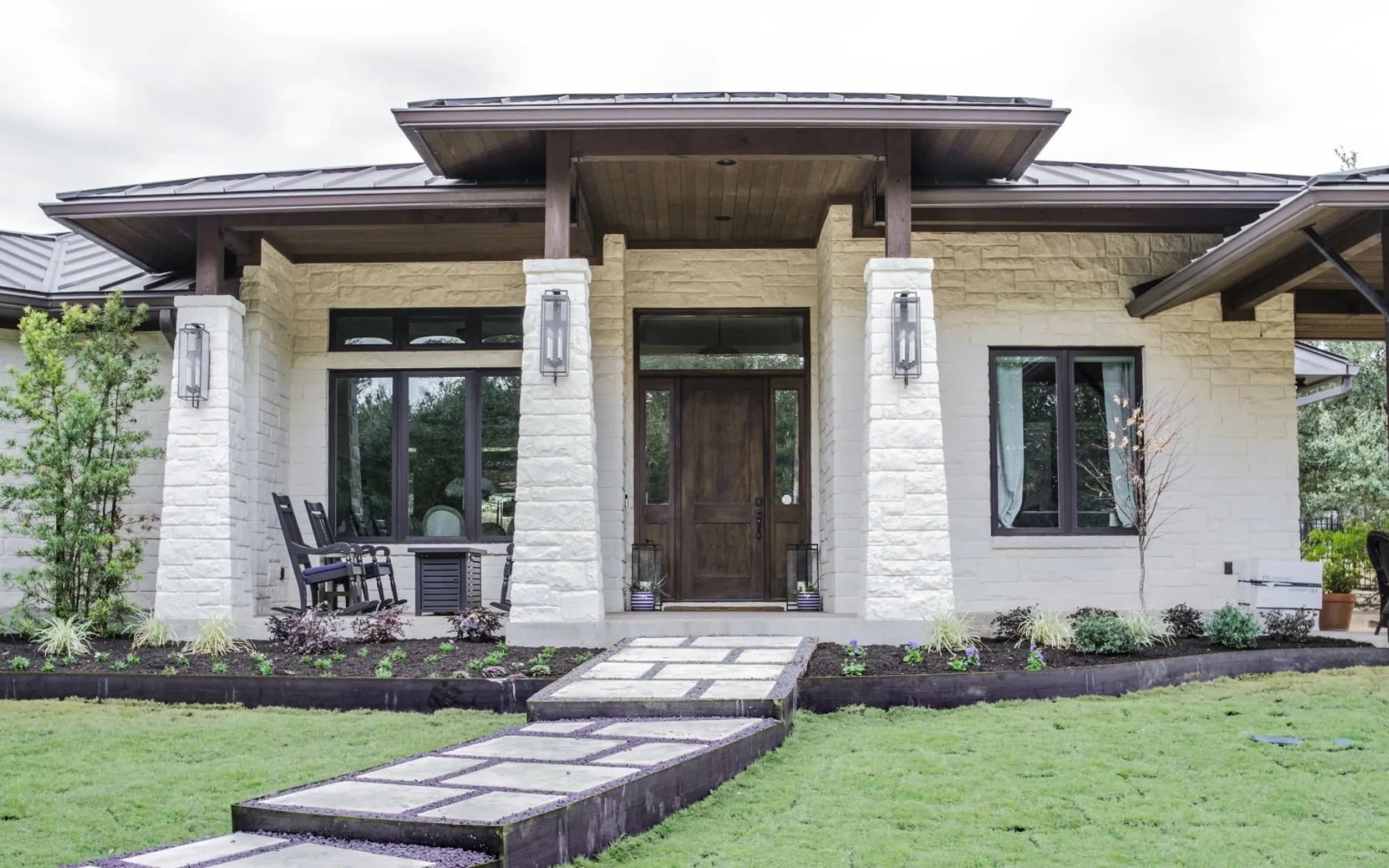 Limewash stone exterior on modern ranch home in Bellaire