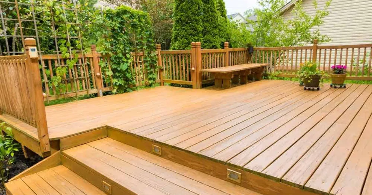 Homeowner enjoying freshly stained wood deck after final walkthrough