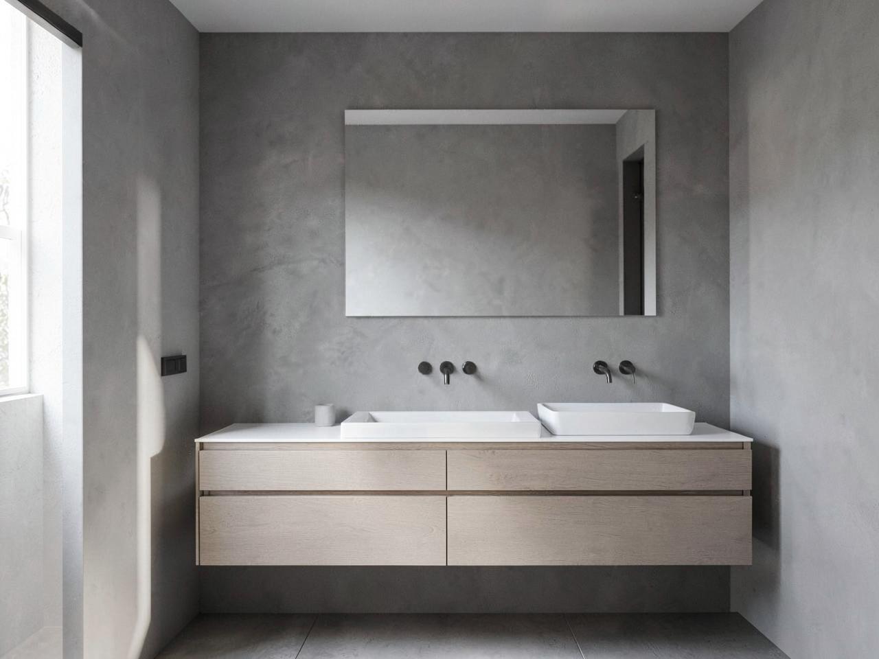 Gray microcement plaster bathroom walls with a floating wood vanity