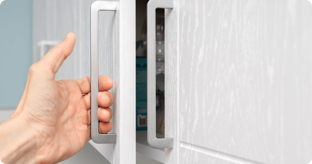cabinet painting in austin-white cabinet with silver decals painted by that 1 painter