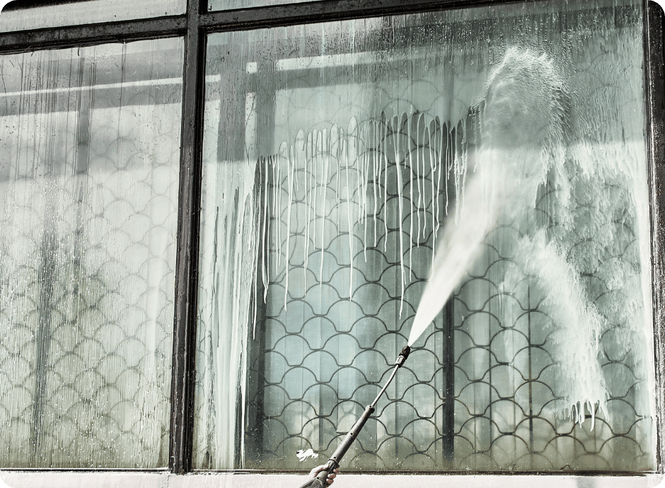 Pressure washing windows to remove dirt, streaks, and buildup for a clear view for that 1 painter