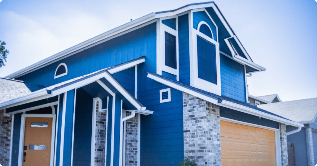 exterior-painting-in-avon-blue-house-with-beautiful-white-trim-from-that-1-painter-1.png