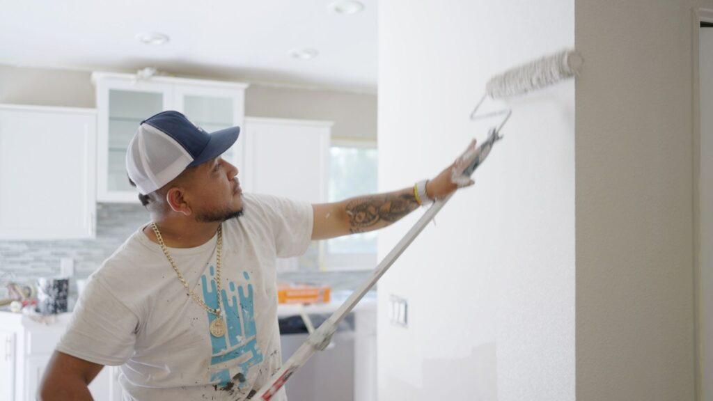 Professional Painting_Painter applying paint to interior walls with roller_That 1 Painter Central PA