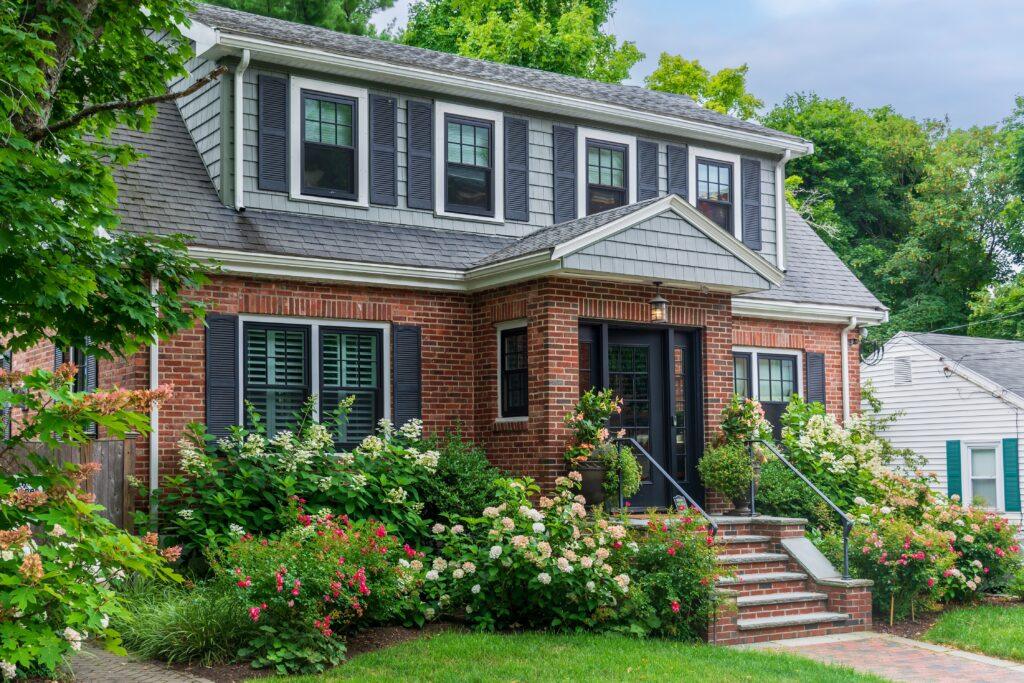 A two toned home with gray paint and brown brick in north carolina_that 1 painter charlotte fort mill