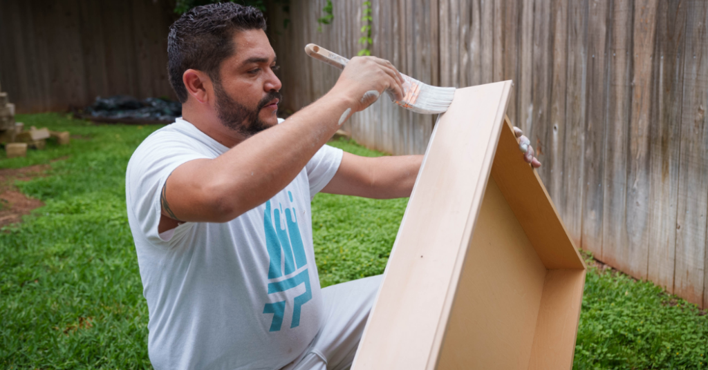 professional painter painting cabinets in a client's backyard_that 1 painter charlotte metro