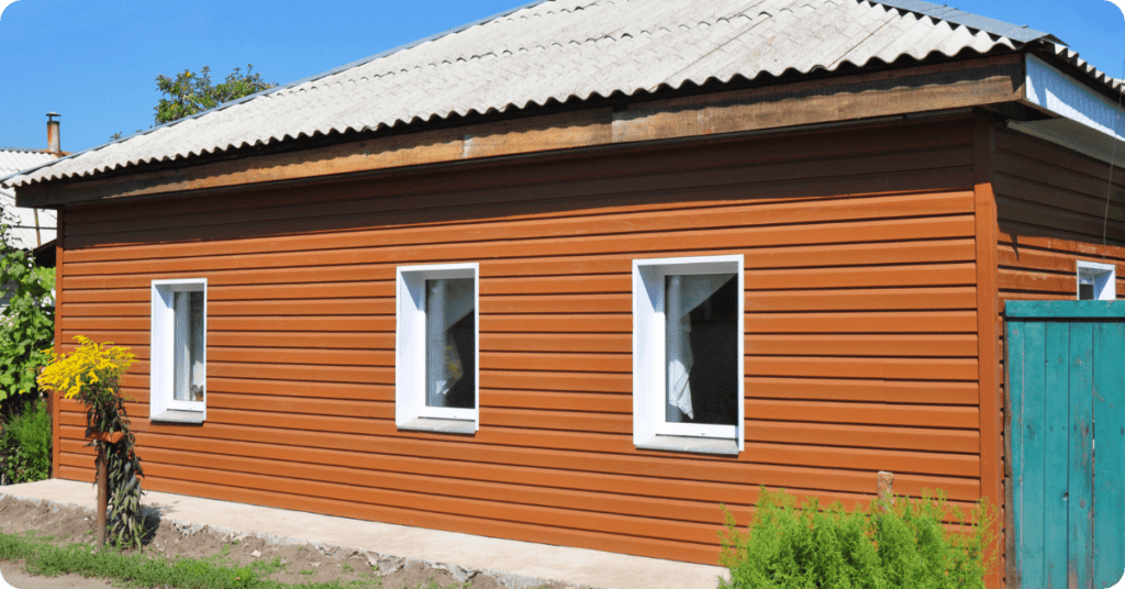 asbestos siding with brown orange paint to make build look new for that 1 painter cherry hill