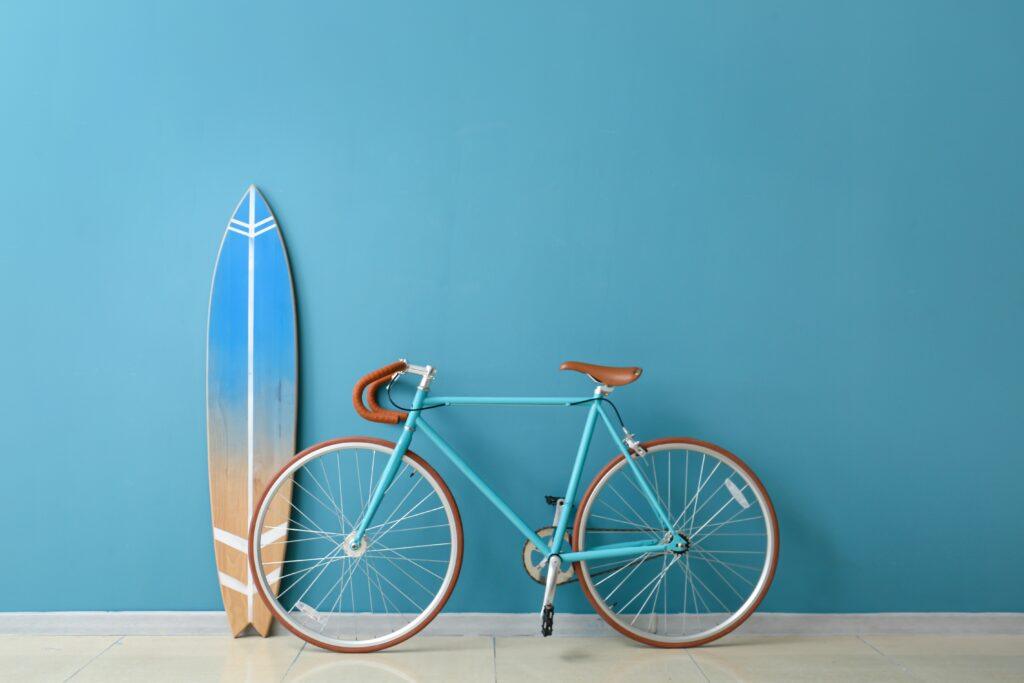 Bicycle and surf board against accent wall_Interior painting in corpus christi_That 1 Painter Corpus Christi