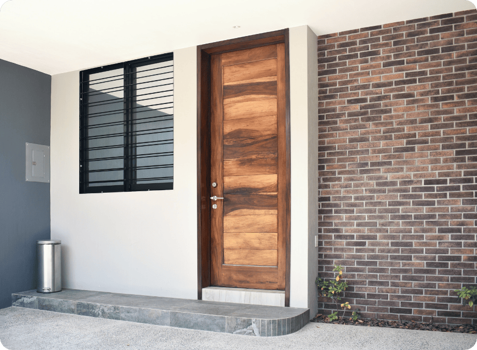 Modern front entry with wood door and freshly painted exterior by painters in Frisco for that 1 painter