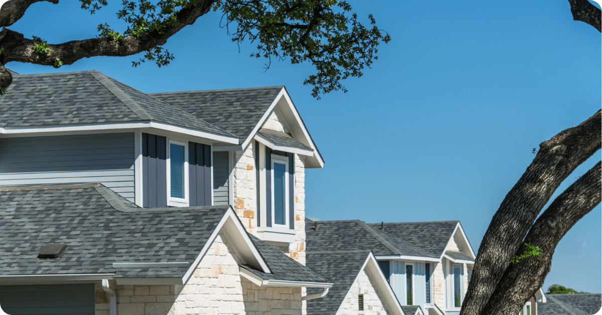 white home with windows and grey roof weatherproofed exterior by that 1 painter dallas professionals