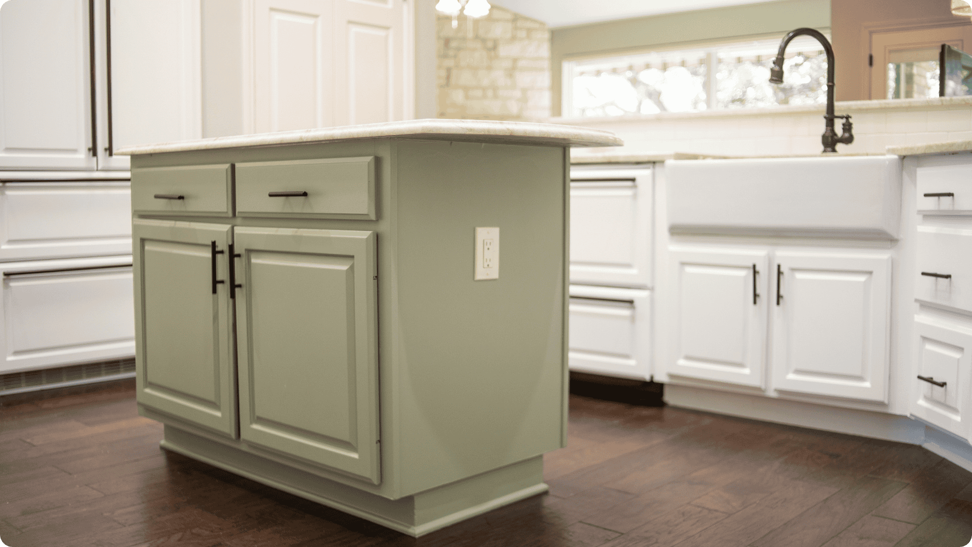 Cabinet painting of a Green two toned kitchen in Diamond State.
