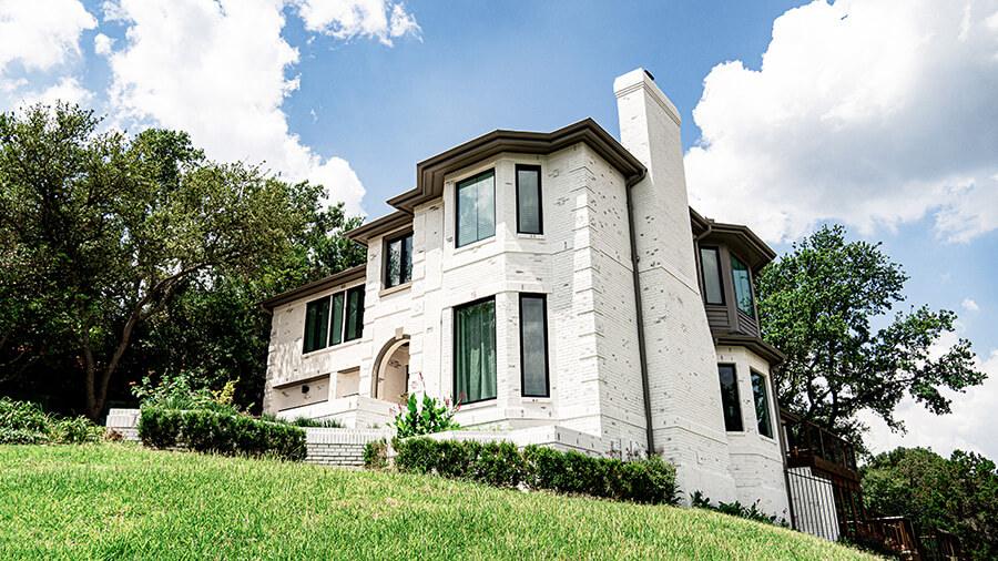 Beautiful limewashed home exterior of home on hill in el paso texas performed by that 1 painter