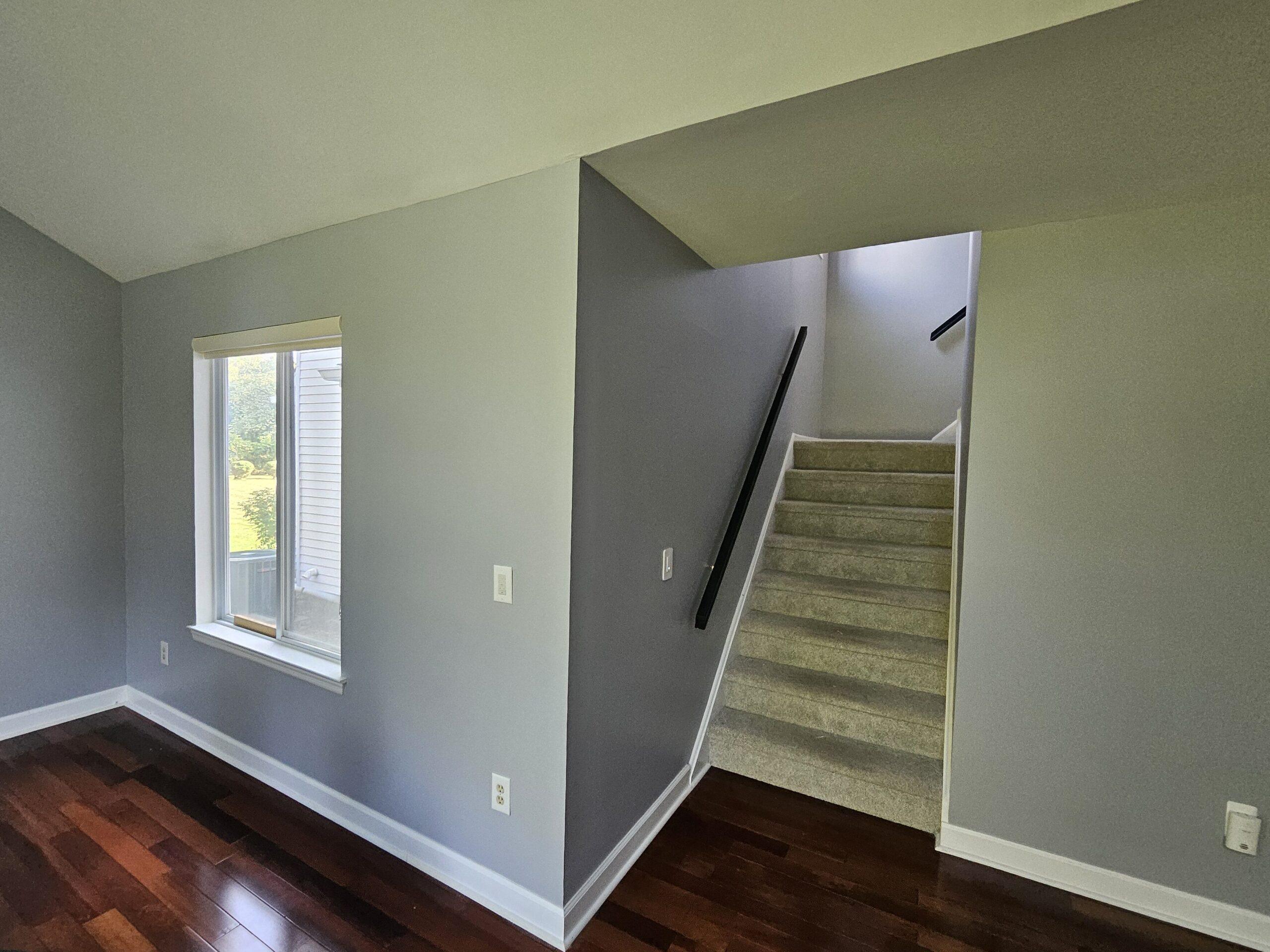 indoors with stairs blue paint finish with stairs and wood floors That 1 Painter Essex