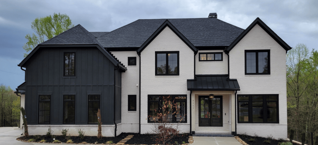 black and white brick house with driveway and windows with long lasting paint for that 1 painter essex