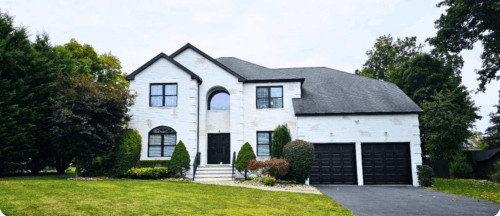 Beautiful exteriors of the house painted white by professional painters in Livingston, NJ