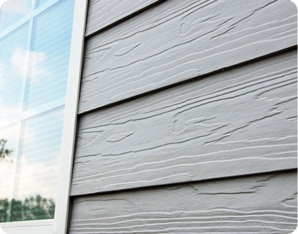 The exterior siding of a home that was painted gray by That 1 Painter Eugene.