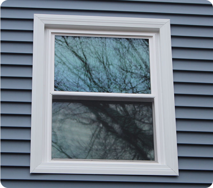 The window frame of a home painted gray - That 1 Painter Eugene.