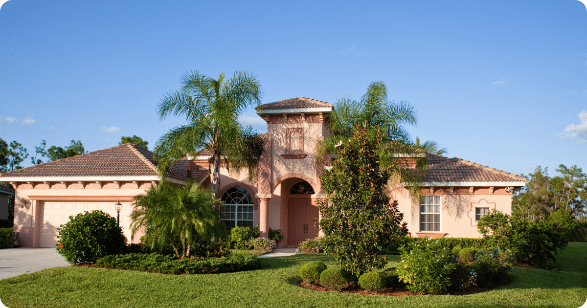 exterior painting in first coast-red stucco with brown roof painted by that 1 painter