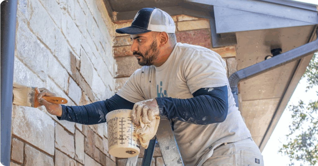 exterior painting in galveston county-professional exterior painter from that 1 painter painting the exterior of a brick home white