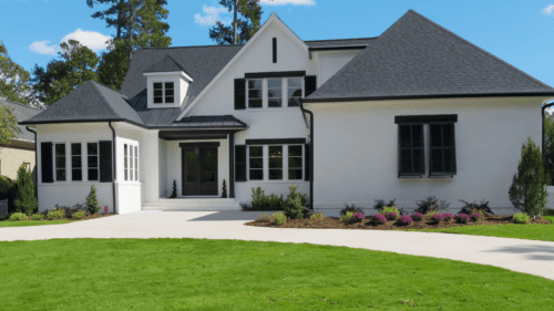 white exteriors of the house with dark trim painted by professional painter in North Chesterfield, VA
