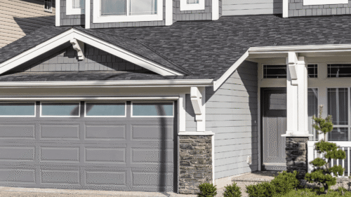 Beautiful gray house with white trim freshly painted by professional painters in Henrico, VA