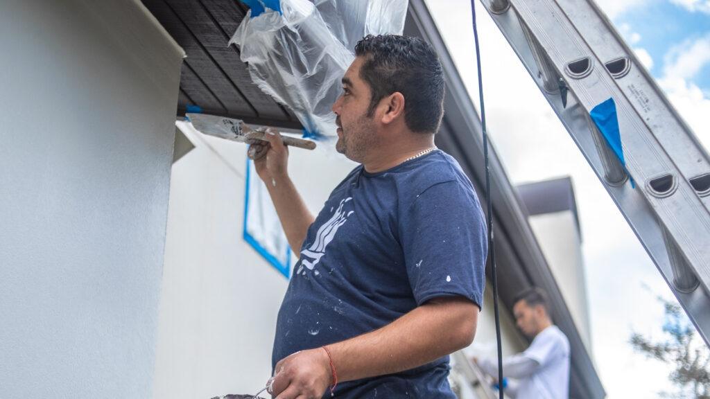 Painters in Houston doing stucco repairs on a home - That 1 Painter Houston