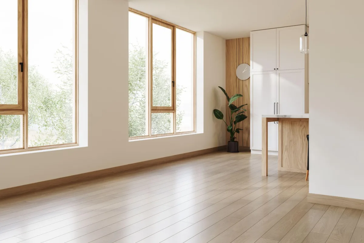 Empty room with tall windows and natural light