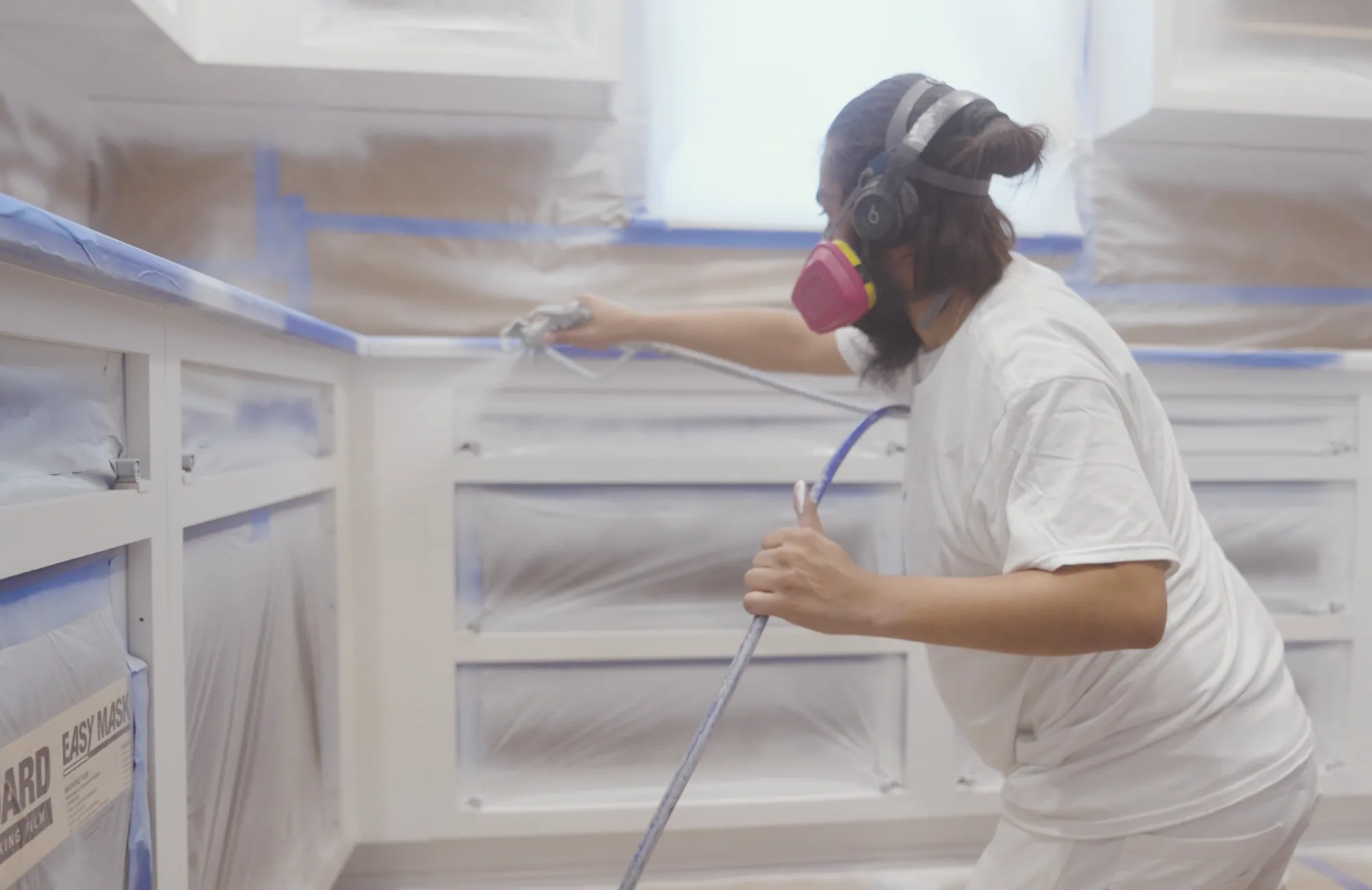 Kitchen cabinet doors and boxes masked off for spray finishing in Tampa, FL