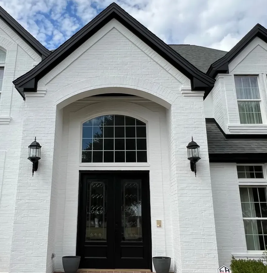 Limewash in Mt Lebanon - PA being applied to a front brick entry wall on a residential home