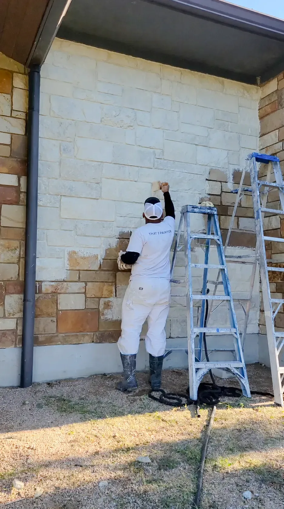 Limewash in Sewickley - PA being brushed onto a brick exterior during a detailed finish update