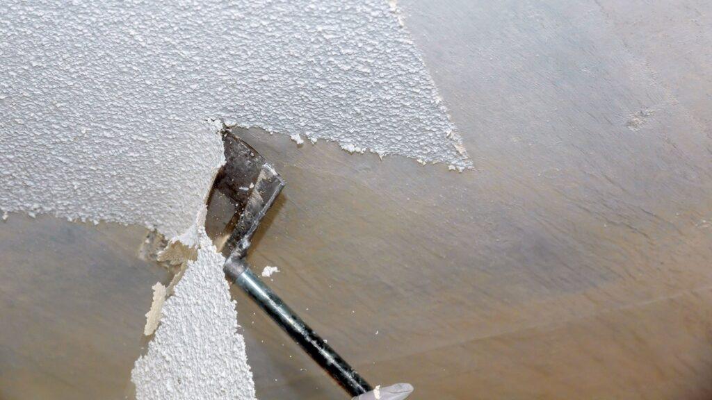 Scraper tool removing the popcorn ceiling of a Loudoun home_That 1 Painter Loudoun
