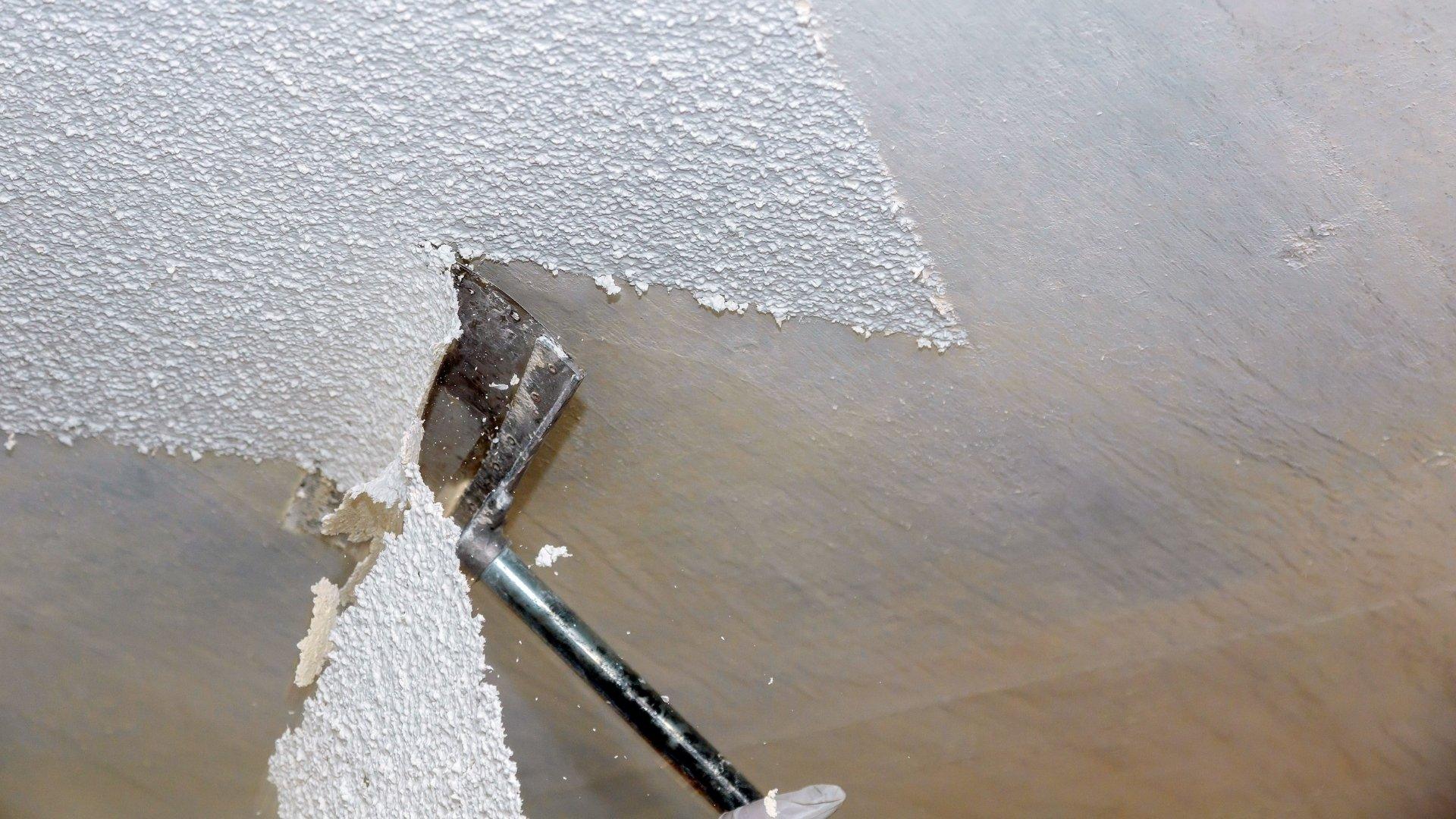 Scraper tool removing the popcorn ceiling of a Loudoun home_That 1 Painter Loudoun
