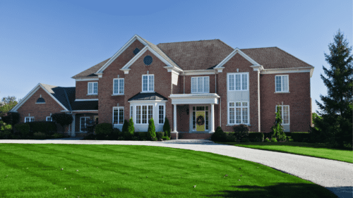 Beautiful red brick house with white trim painted by professional painters in Sterling, VA