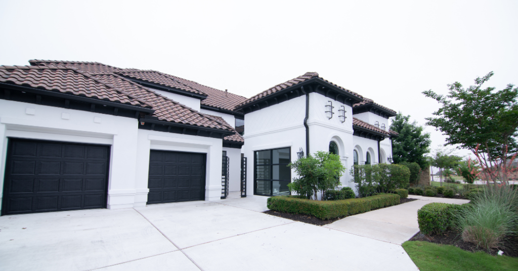 The exterior of a home in Naples that was freshly painted white by That 1 Painter Naples.