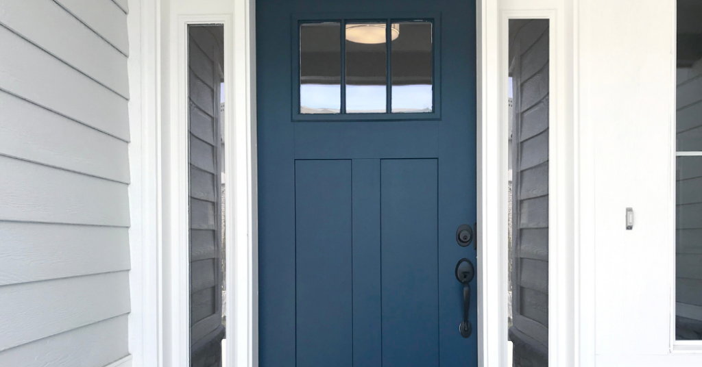 A blue door that used the front door painting services of That 1 Painter Naples.