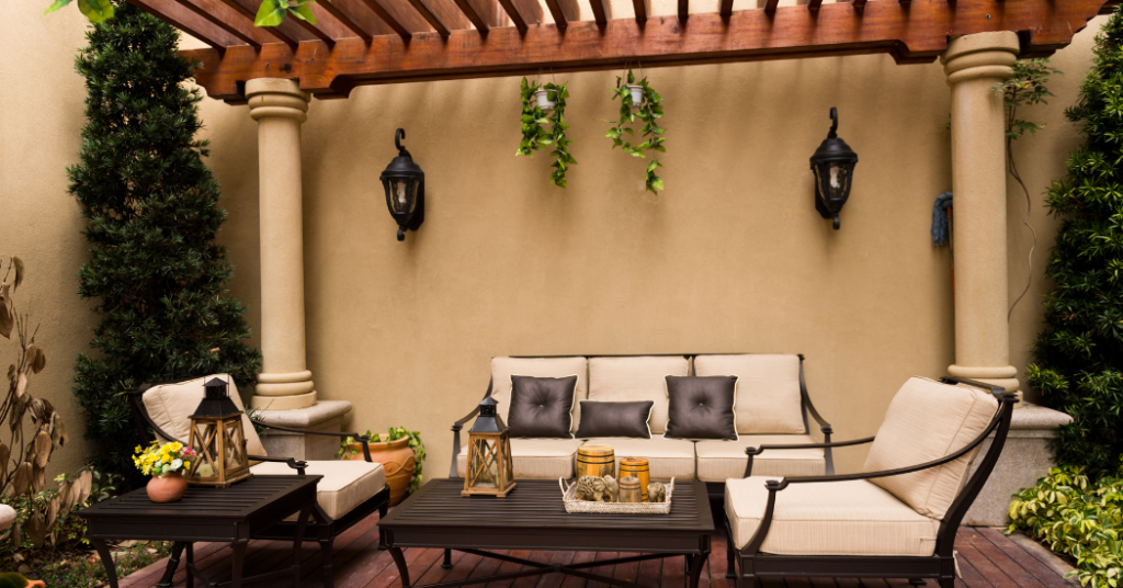 An image of a home patio with couches and tables in Naples, Florida.