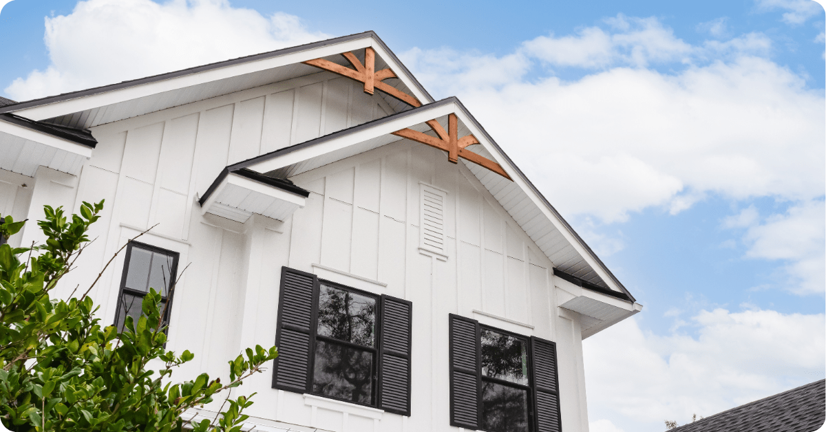 exterior painting in new braunfels-white home with black trim and brown trim painted by that 1 painter