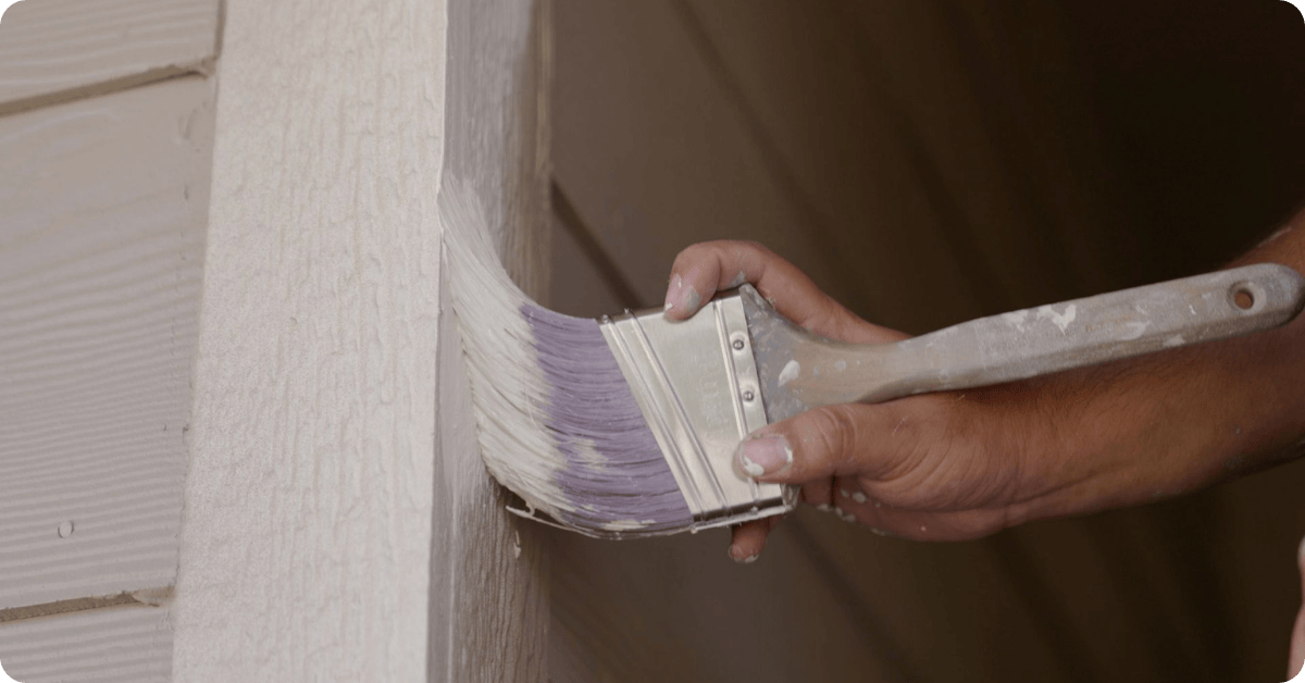 paint brush painting with cream paint with exterior paint for that 1 painter north denver