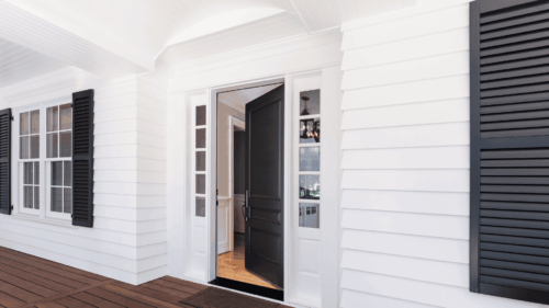 Beautiful white exterior and dark door and window panels painting work done by professional painters in Ramsey, NJ