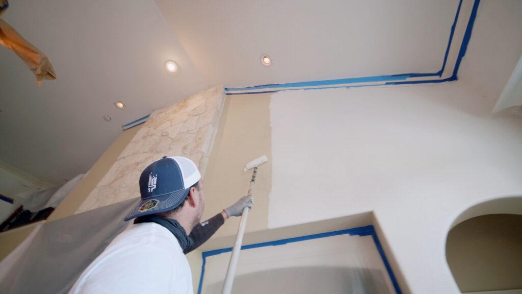 that1painter employee painting interior wall doing interior house painting