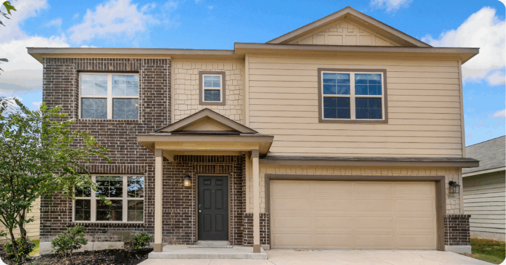 exterior painting in northwest san antonio- two story home with light brown paint and dark brown brick painted by that 1 painter