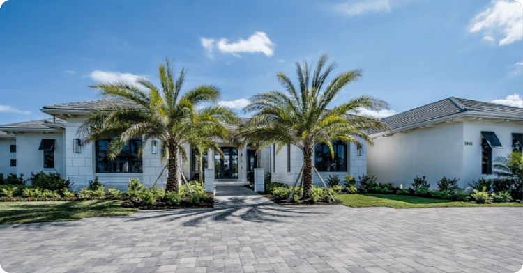 a large white stucco home with big palm trees painted by professional painters_That 1 Painter Orlando